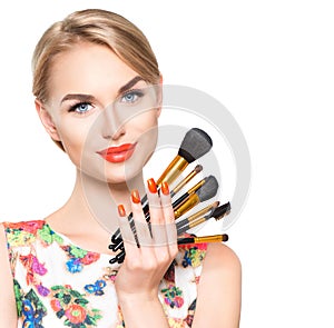 Beauty woman with makeup brushes