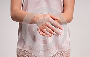 Beauty. Woman massaging her hands.