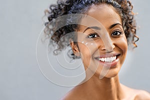 Beauty woman with moisturizer on face