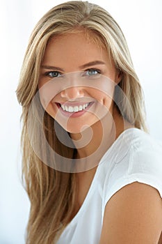 Beauty Woman Portrait. Girl With Beautiful Face Smiling photo