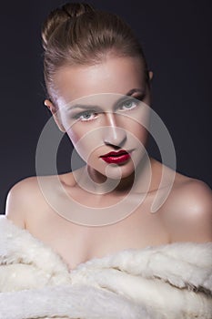 Beauty Woman Portrait in white fur coat with fresh clean skin, s photo