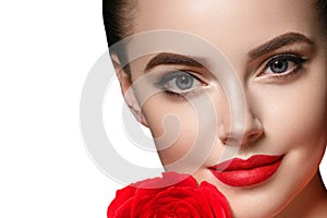 Beauty woman with rose flower beautiful curly hair and lips