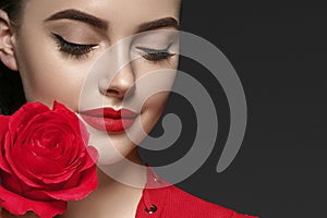 Beauty woman with rose flower beautiful curly hair and lips