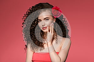 Beauty woman with rose flower beautiful curly hair and lips