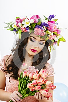 Beauty Woman with Spring Flower bouquet. Beautiful girl with a B