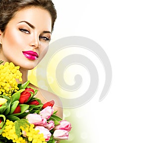 Beauty woman with spring flowers bouquet