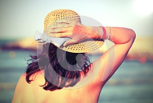 Beauty woman with straw hat and  with old toned effect