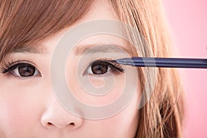 Beauty woman take eyeliner