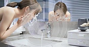 Beauty woman wash her face