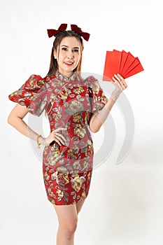 Beauty woman wear cheongsam and take Red envelopes in chinese new year
