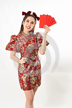 Beauty woman wear cheongsam and take Red envelopes in chinese new year