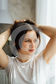 Beauty woman with white perfect smile looking at camera at home