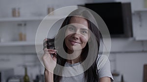 Beauty woman with white perfect smile looking at camera at home