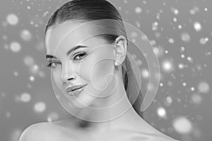 Beauty Woman Winter Snow face Portrait. Beautiful Spa model Girl