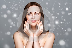 Beauty Woman Winter Snow face Portrait. Beautiful Spa model Girl