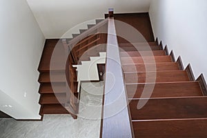 Beauty wooden top viw going down stair in new house . oak color iron Handrail decor interior estate