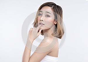 Beauty Young asian woman with perfect facial skin. Gestures for advertisement treatment spa and cosmetology