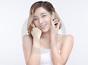 Beauty Young asian woman with perfect facial skin. Gestures for advertisement treatment spa and cosmetology