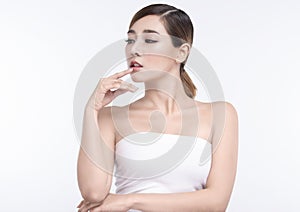 Beauty Young asian woman with perfect facial skin and lips. Gestures for advertisement treatment spa and cosmetology