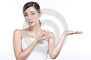 Beauty young asian woman showing hand for product on white background. treatment & Skin care concept