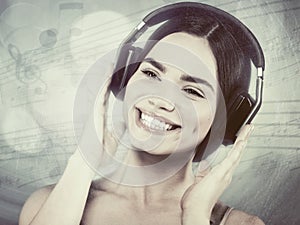 Beauty young girl hearing music with headset