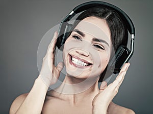 Beauty young girl hearing music with headset