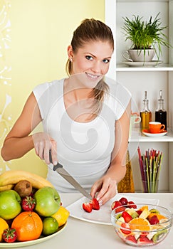 Beauty, young girl making fruit-salad