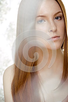 Beauty young redhead woman with red flying hair, funny ginger fresh spa girl isolated on white background