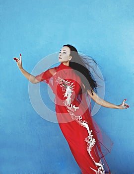 Beauty young vietnamese woman in red national ethnic costume