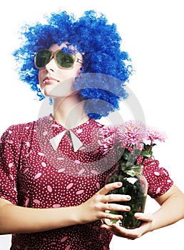 Beauty young woman in a blue wig with flowers