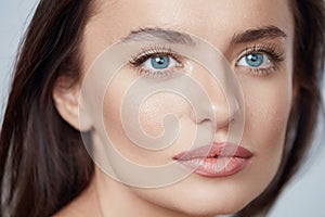 Beauty. Young Woman Close Up Portrait. Beautiful Blue-Eyed Model With Perfect Skin And Natural Daily Makeup.