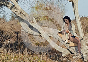 Beauty young woman in savanna walking, dreaming