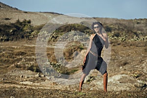 Beauty young woman in savanna walking, dreaming