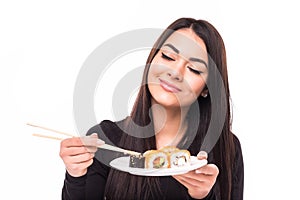 Beauty young woman with sushi in front of her eye on white background