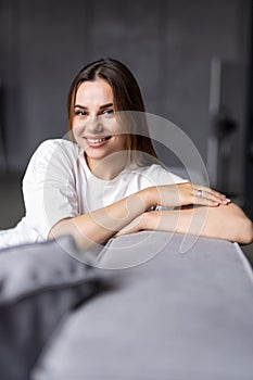 Beauty young woman with white perfect smile looking at camera at home