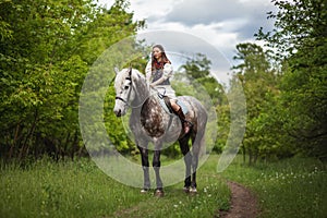 Beautyful woman with horse in Ukrainian national dress.