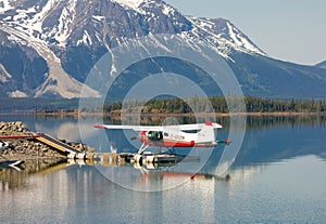 A beaver seaplane tied to a dock in northern bc