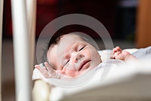 Bebe with yellow and white body lying on baby hammock