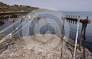 Bec du Nez, Jetty Edge with Mooring Ropes and Ladder, View of Coast, Fermaine Bay and Saint Peter Port Fort, Guernsey. photo