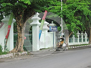 The Becak Driver in Front of Jogja Hospital Gate photo