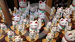 Beckoning cat figurines in a store window of chinatown in san francisco
