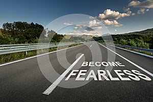 Become Fearless message on Asphalt highway road through the countryside