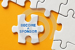 Become a sponsor message on a puzzle piece apart form the assembled pieces. Financial sponsorship support or charity donation