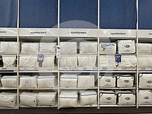 Bed Bath and Beyond retail store wall of comforters