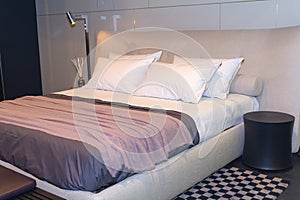 Bed in the bedroom in modern style