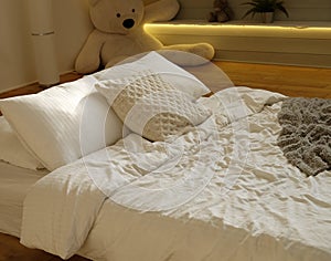 Bed in the bedroom, white pillows and cozy linens
