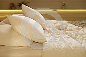 bed in the bedroom  white pillows and cozy linens