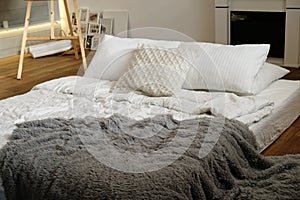 Bed in the bedroom, white pillows and cozy linens, close up