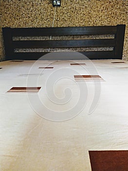 Bed with bedsheet cover mattress in bedroom