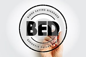 BED Binge Eating Disorder - severe, life-threatening, and treatable eating disorder, acronym text concept stamp